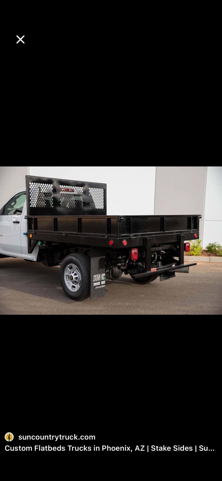 Heavy-duty stake flatbed with headache rack